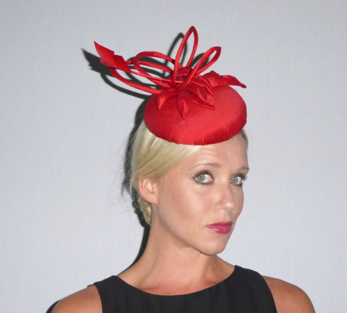 Button Fascinator in Red Dupion silk decorated with loops, leaves and Arrow head Feather