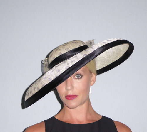 Ascot style large brimmed hat in deep Ivory and Black spot Sinamay with black satin trim. ( definitely a Audrey Hepburn look alike)