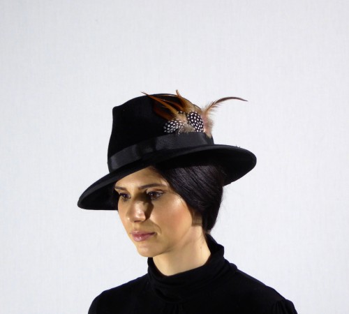 Black Velour Fedora decorated with Guinea Fowl Feathers and Black hatband.