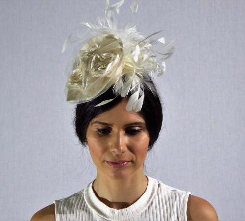 Cupped leaf fascinator with ivory flowers and feathers